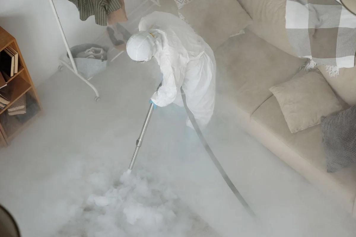 Biohazard cleanup technician in protective equipment, Thorsby, AL